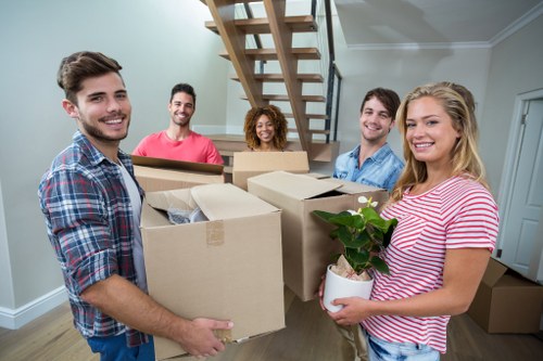 Professional same day removals team loading boxes in Camden