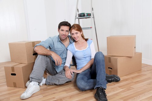 Mover handling a sofa through a property doorway